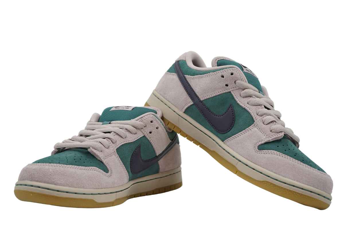 Pair of brand new Nike SB Dunk Low sneakers in Mineral Slate and Particle Rose suede