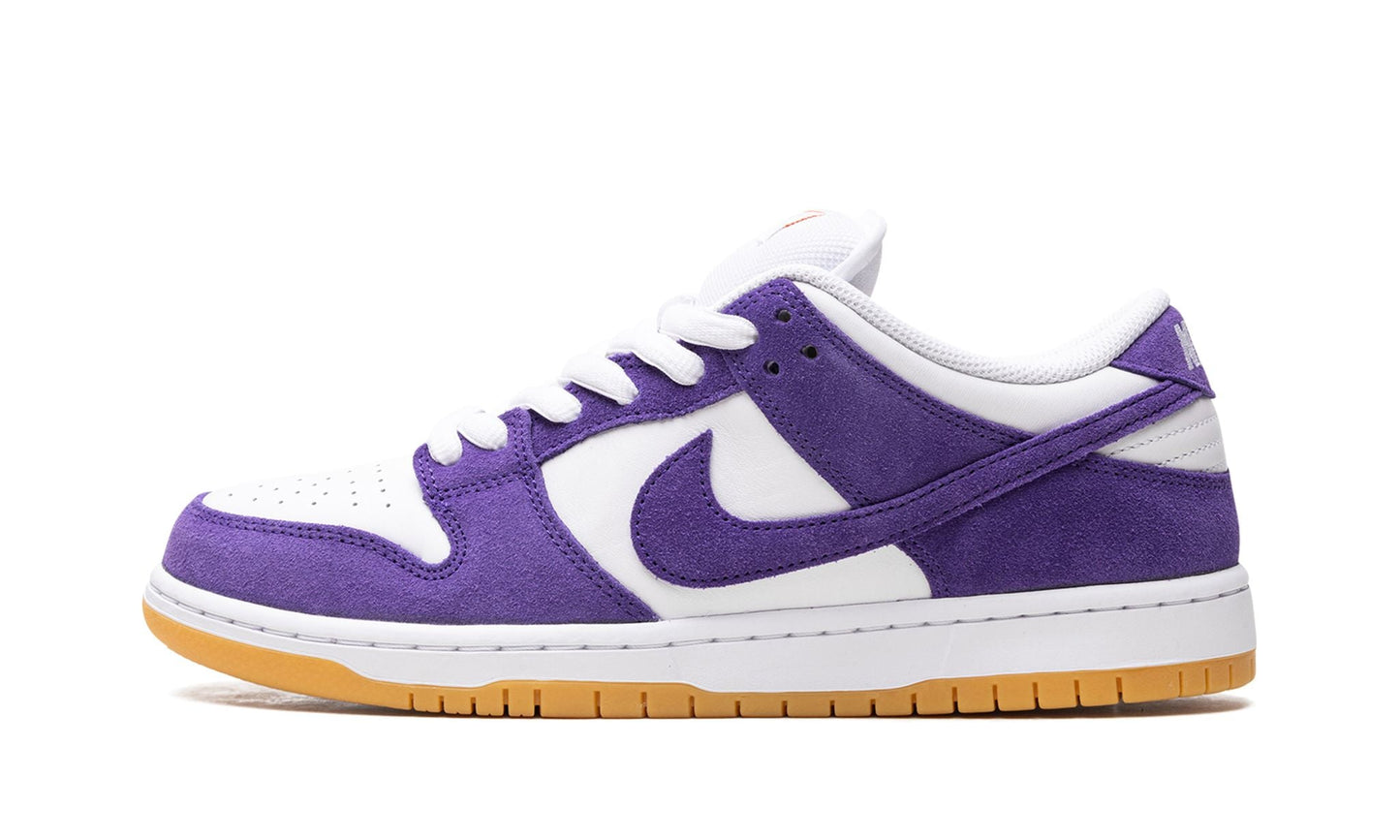 Nike SB Dunk Low Orange Label featuring a premium white leather upper, Court Purple swoosh, and classic gum outsole. Skate shop exclusive sneaker available at our Malmö store.
