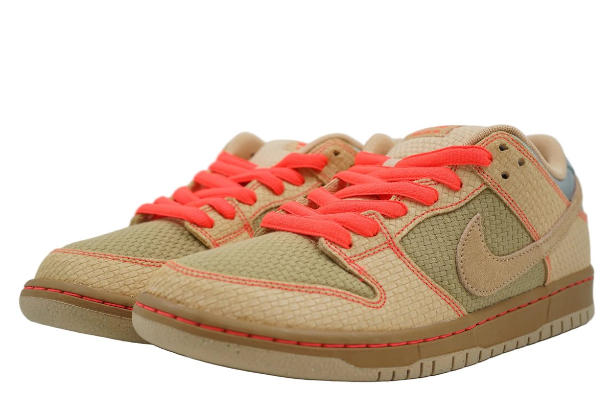 Brand new pair of Nike SB Dunk Low Som Tum with woven tan upper and bright crimson laces, front view