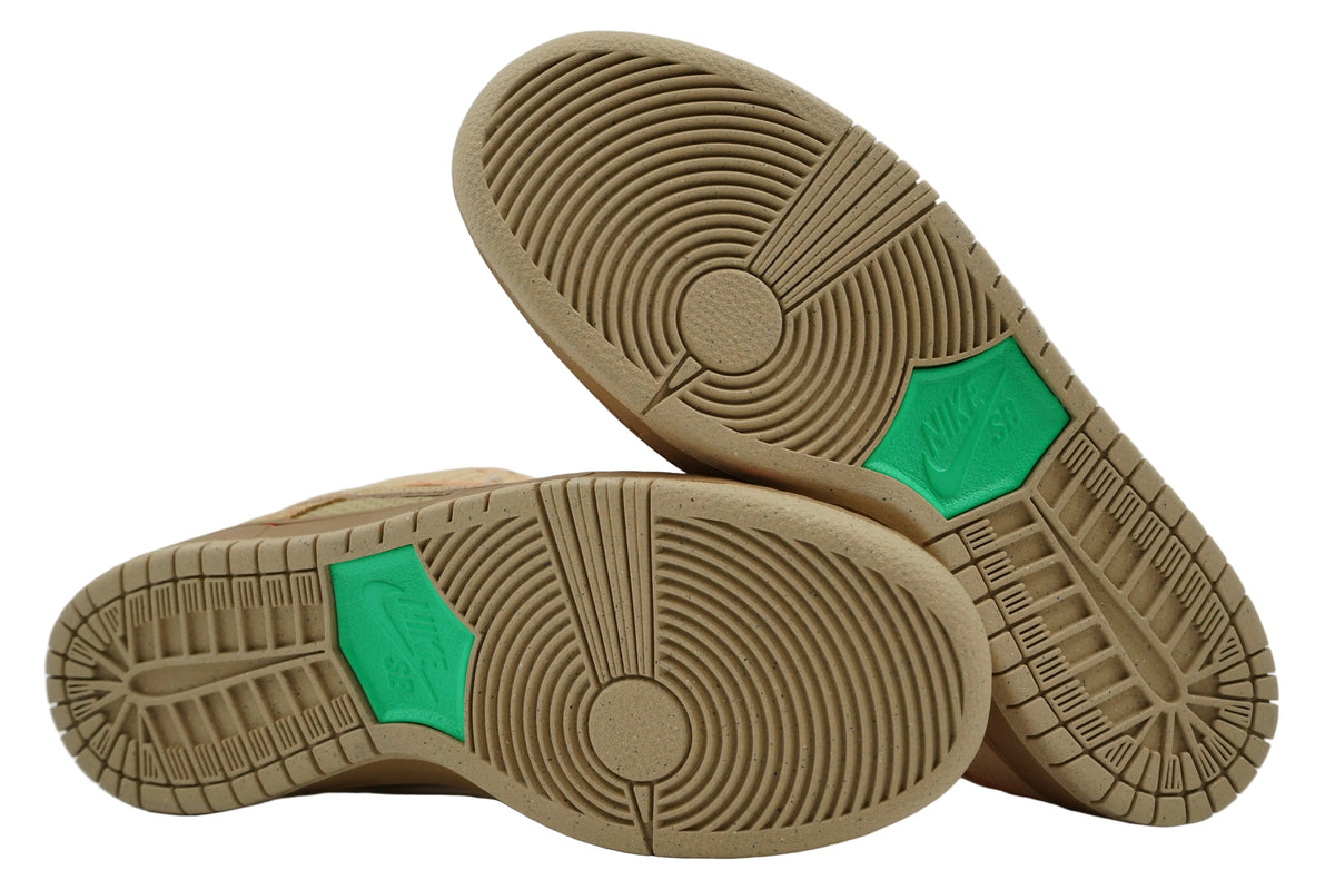 Unworn speckled tan outsoles of Nike SB Dunk Low Som Tum with green Nike SB logo panel
