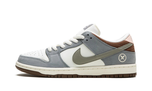 Nike SB Dunk Low x Yuto Horigome featuring Wolf Grey suede and signature cross-feather logo embroidery. Limited edition sneaker available at our Malmö store or order online now.