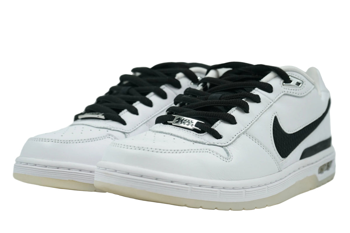 Pair of Nike SB Zoom Air Paul Rodriguez 1 OG in white leather with black laces and chrome lace dubrae, front view
