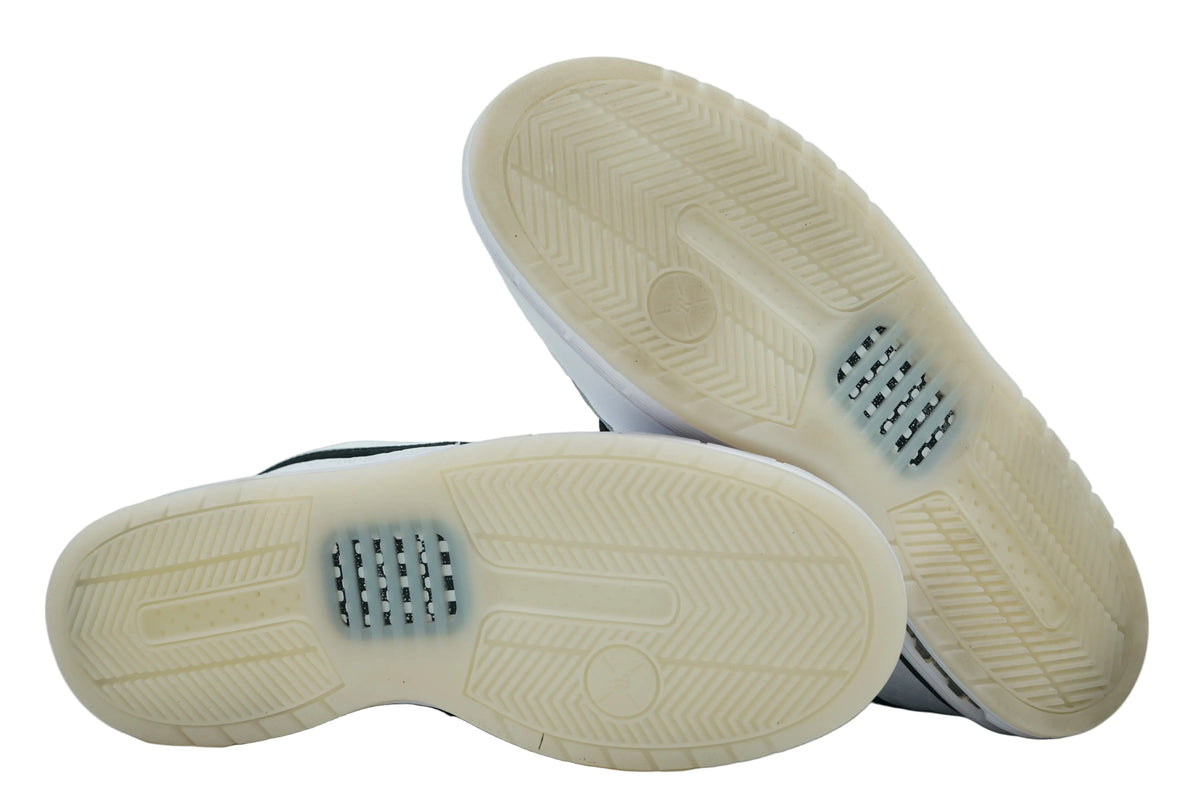 Icy translucent outsoles of Nike SB Zoom Air Paul Rodriguez 1 OG with herringbone tread and Zoom window