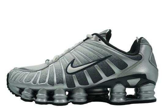 Nike Shox TL 'Metallic Silver' featuring a breathable mesh upper, reflective cage overlay, and full-length mechanical cushioning columns. Retro Y2K sneaker available at our Malmö store