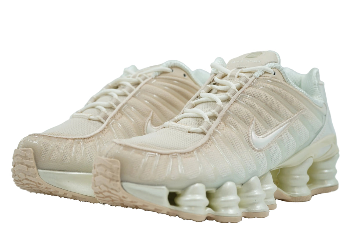 Pair of brand new Nike Shox TL Pearl White with cream laces and beige mesh upper, front view