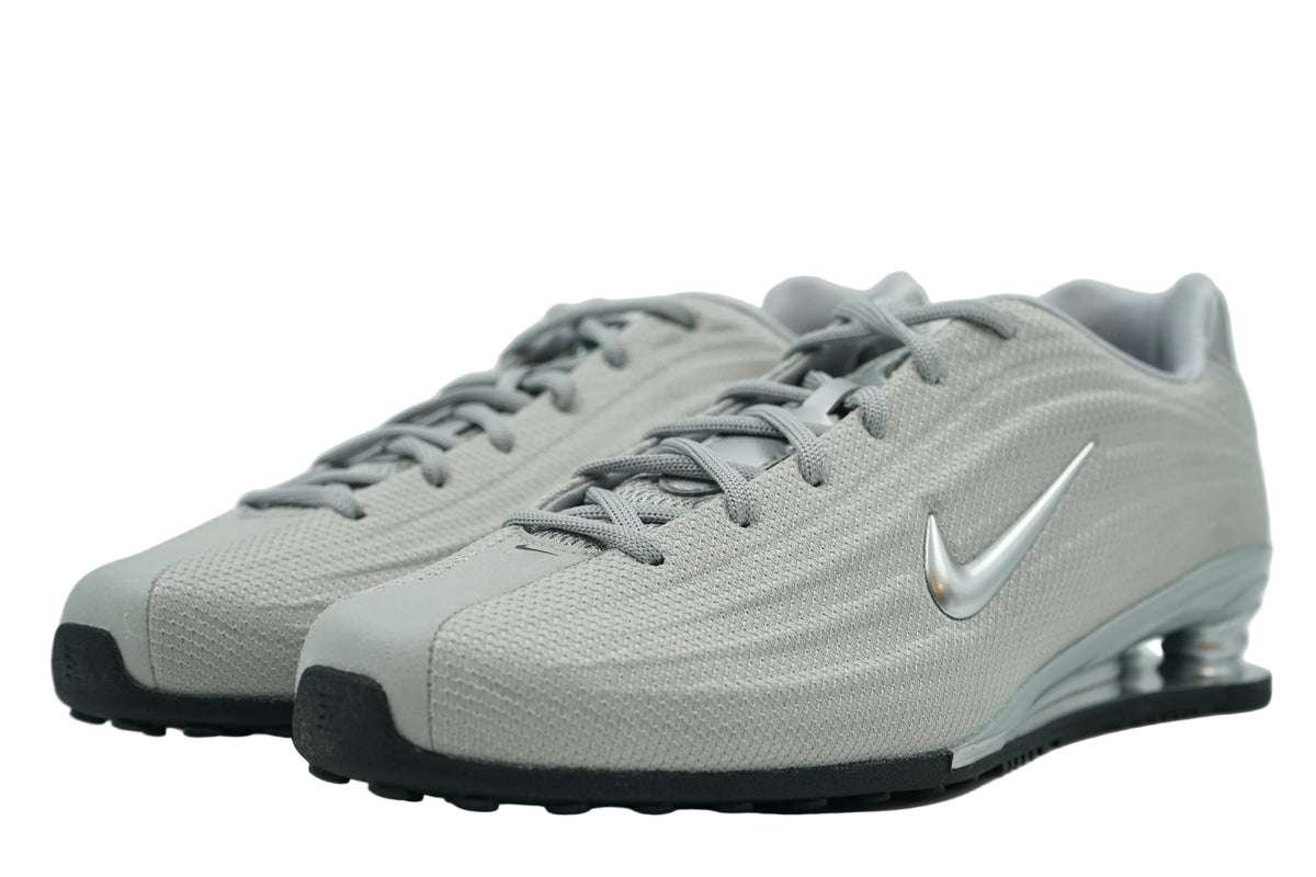 Pair of brand new Nike Shox Z Metallic Silver with grey laces and low-profile mesh upper, front view