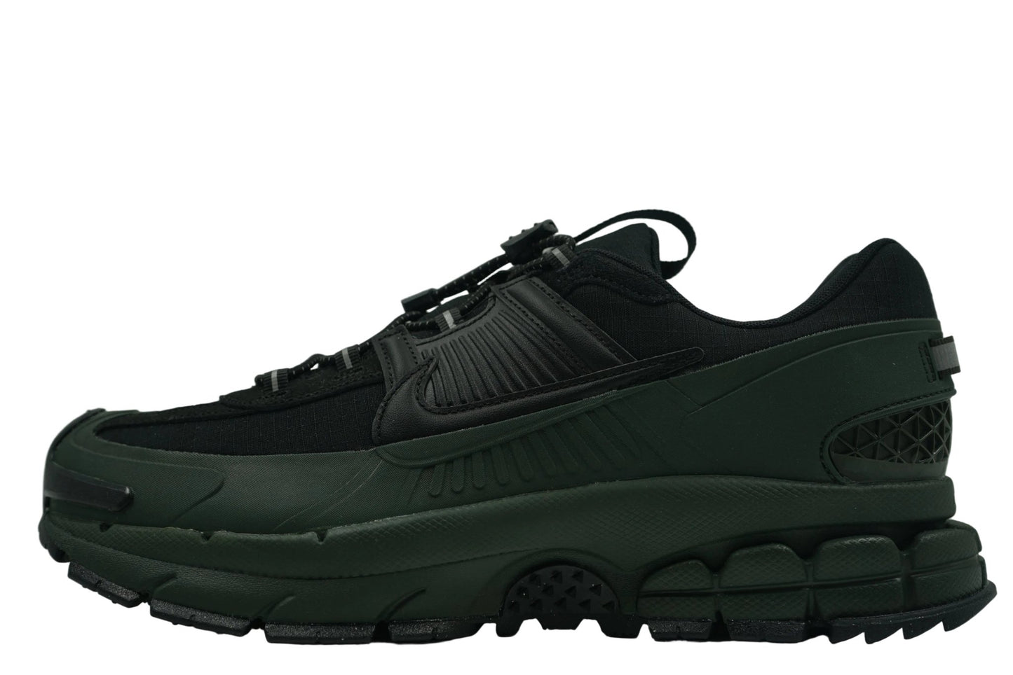 Nike Zoom Vomero 5 Roam 'Sequoia' featuring a water-repellent green and black upper, rubberized mudguards, and toggle lacing. Winterized gorpcore sneaker available at our Malmö store.