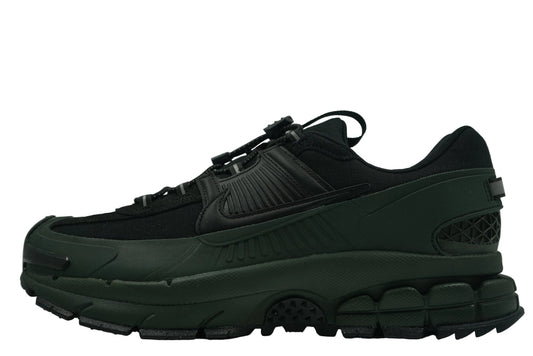 Nike Zoom Vomero 5 Roam 'Sequoia' featuring a water-repellent green and black upper, rubberized mudguards, and toggle lacing. Winterized gorpcore sneaker available at our Malmö store.