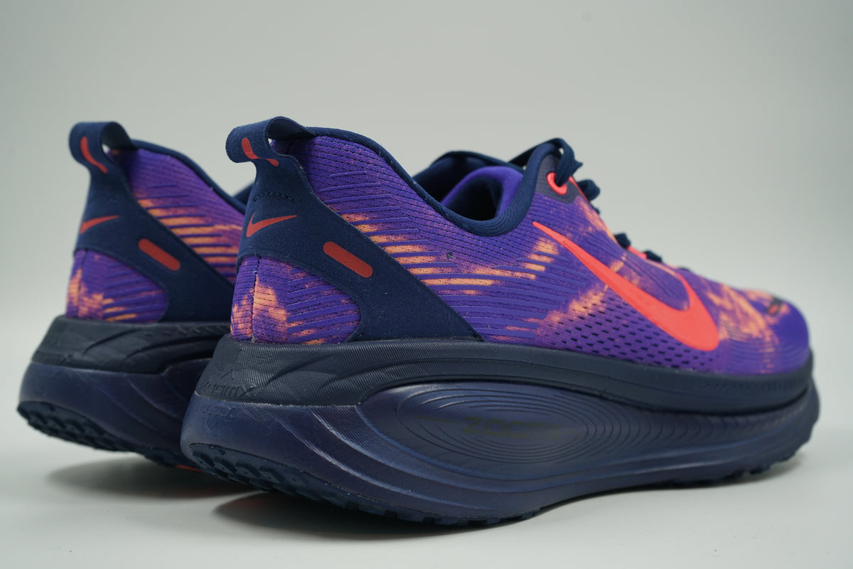 Pair of pre-owned Nike ZoomX running shoes in purple and crimson, back view with navy heel and pull tab