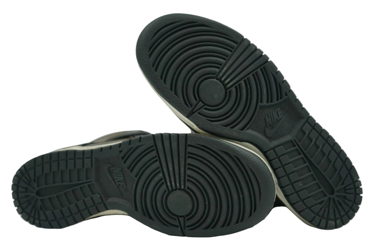 Black outsoles of brand new Pawnshop x Nike SB Dunk High Old Soul with full tread and Nike logo