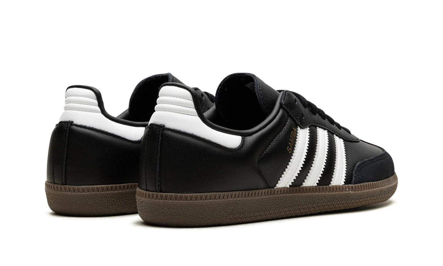 Classic Adidas Samba OG Black Gum (B75806) featuring core black leather, white stripes, and a gum rubber sole. Available at our Malmö store.