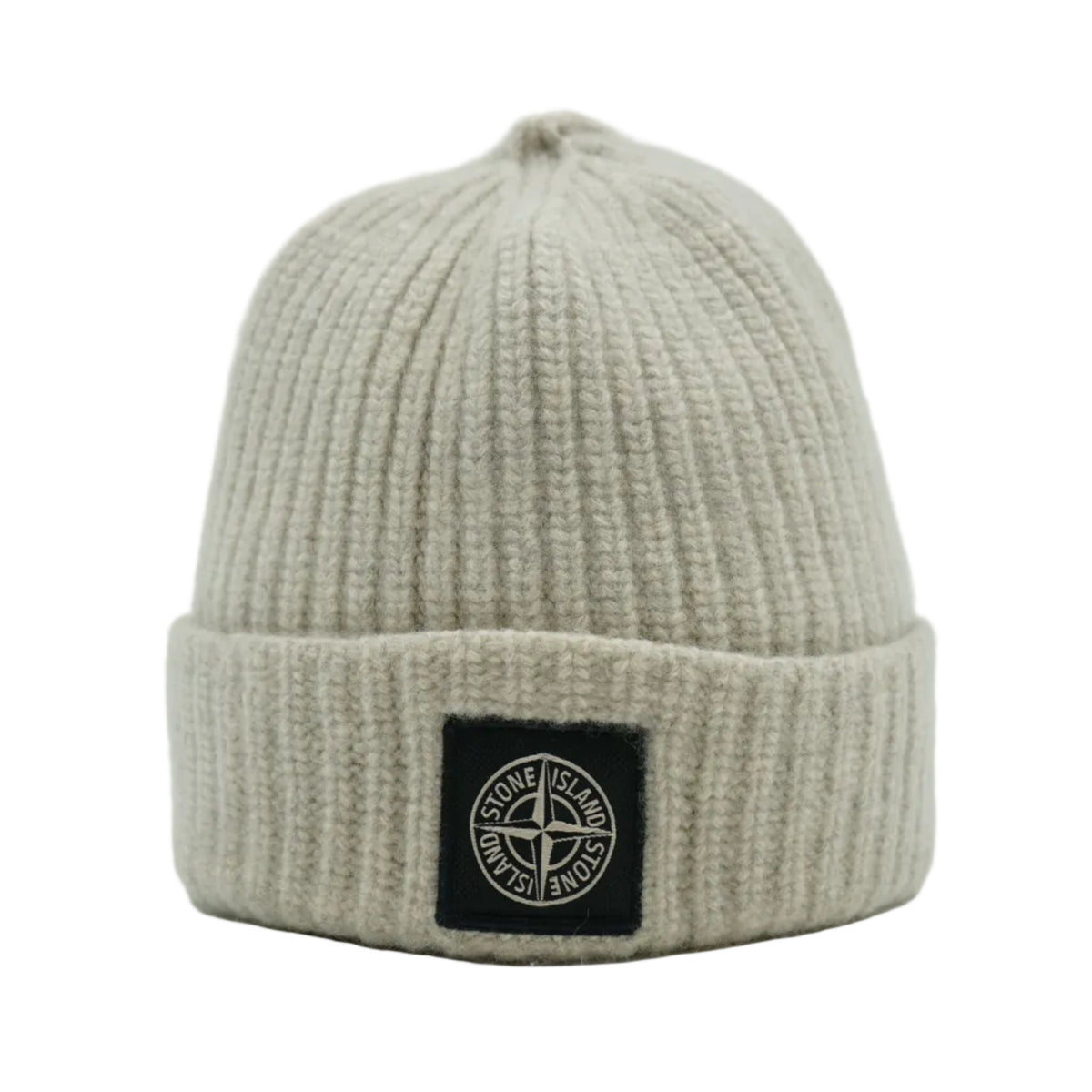Stone Island ribbed knit beanie in light beige with black compass logo patch on cuff, front view