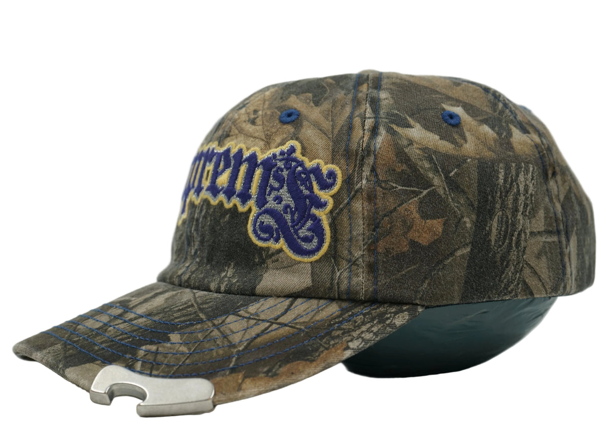 Supreme Bottle Opener 6-Panel cap in tree camo with purple gothic logo and metal opener on peak, side view