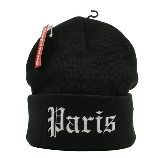 Brand new Supreme New Era Shop Paris Beanie FW26BN33G in black with white branding, front view