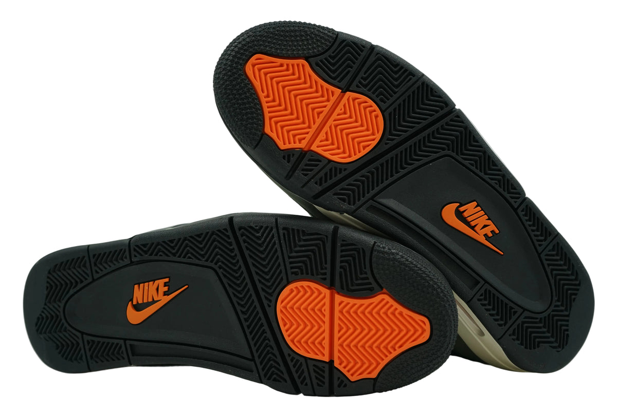 Unworn black outsoles of Undefeated x Air Jordan 4 2025 with orange forefoot pods and orange Nike logo