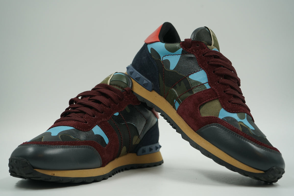 Pair of pre-owned Valentino Garavani Rockrunner in blue camo and burgundy suede, stacked view of inner sides