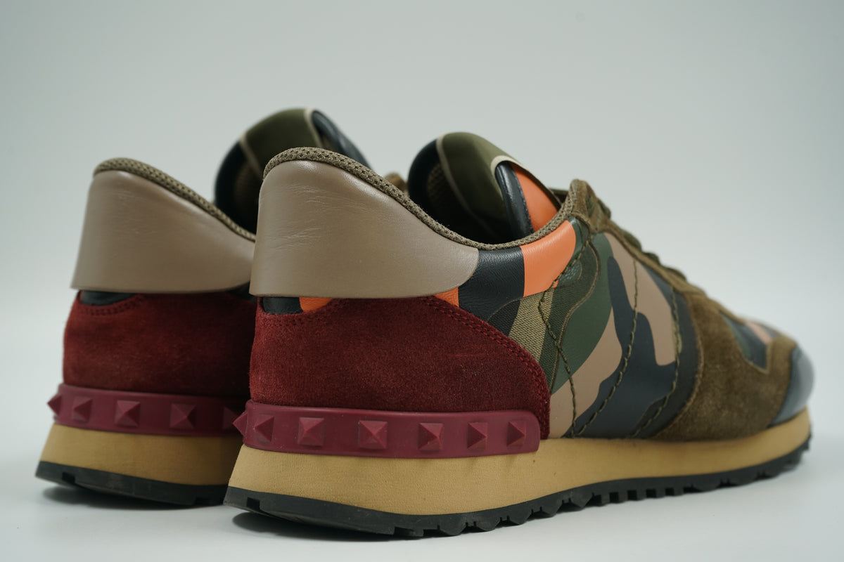 Pair of pre-owned Valentino Garavani Rockrunner camo sneakers, back view with burgundy Rockstud heel counters