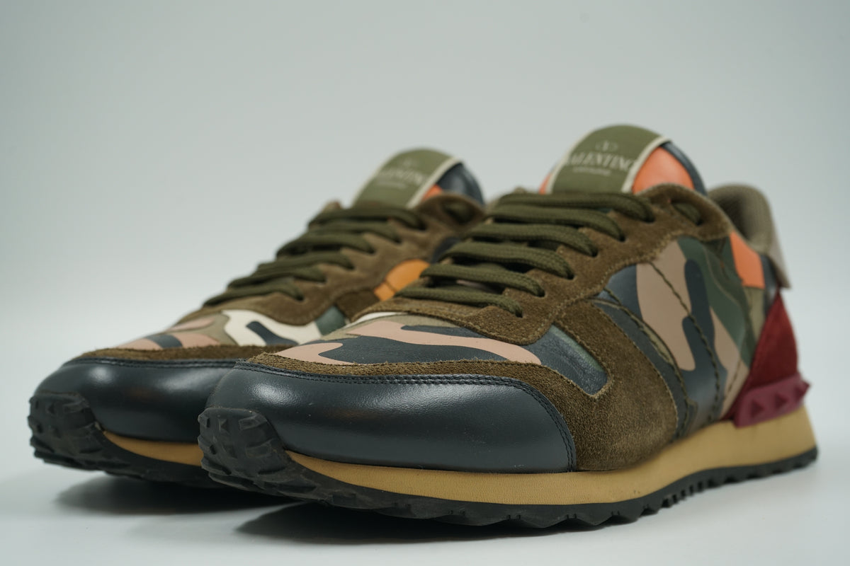 Pair of pre-owned Valentino Garavani Rockrunner camo sneakers with olive suede and black leather toe, front view