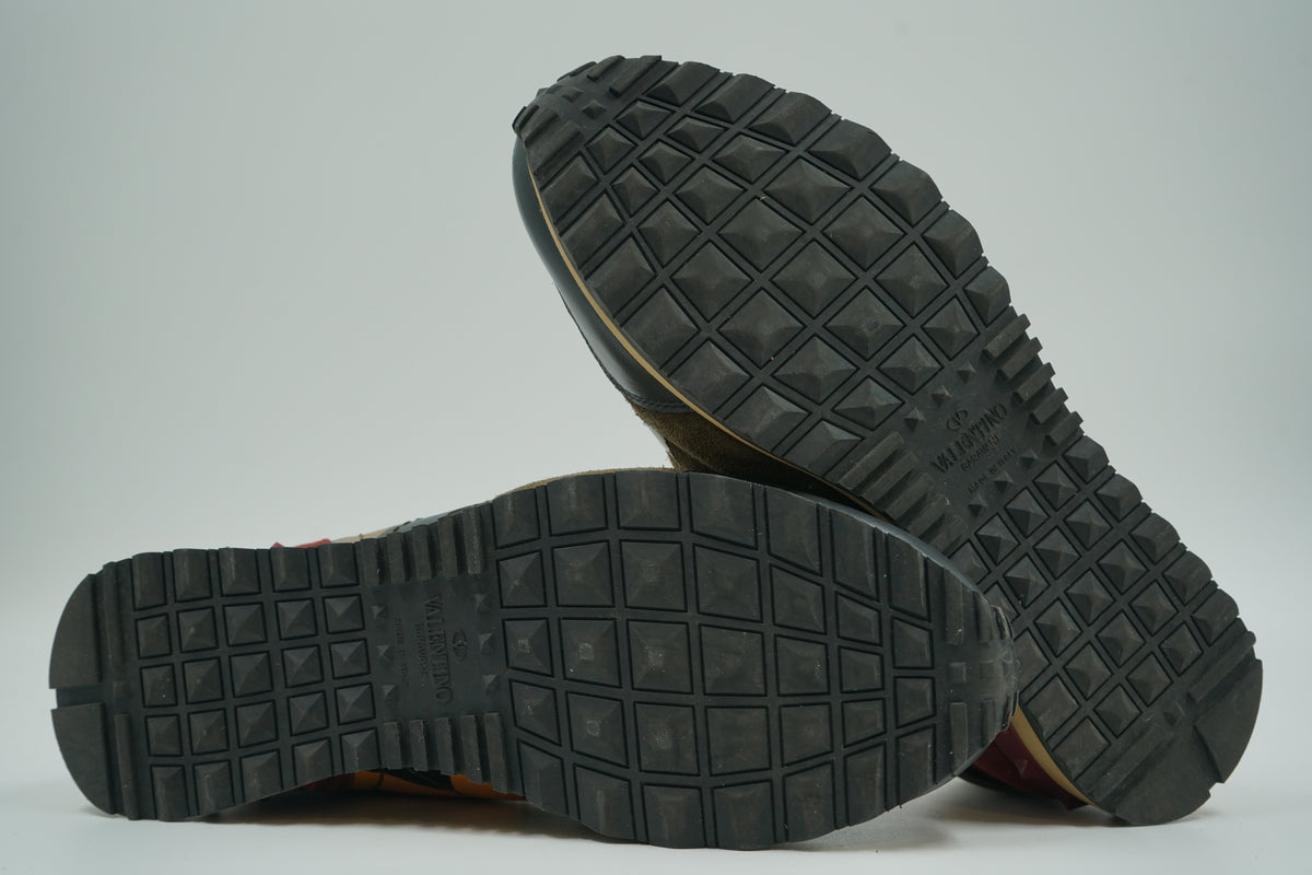 Pre-owned Valentino Garavani Rockrunner camo sneakers, outsole view with stud-pattern tread and Valentino logo